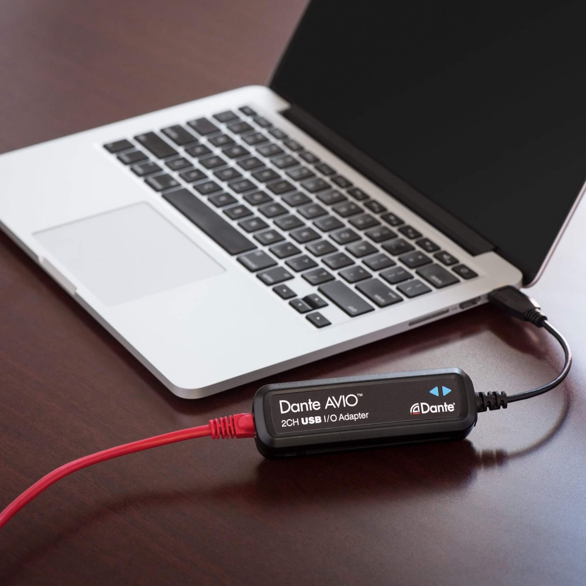 Audinate Dante AVIO 2-Channel USB I/O Adapter, connected to a MacBook Pro laptop