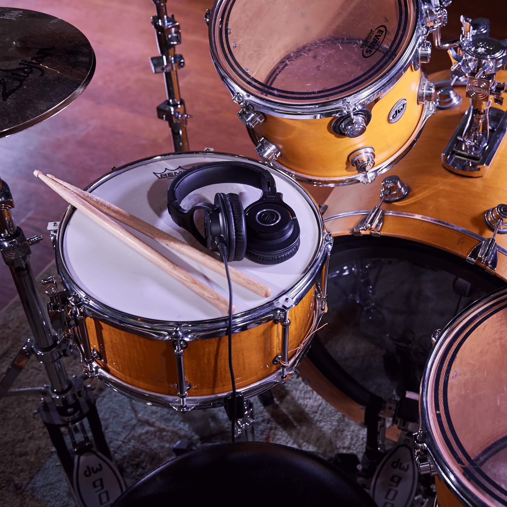 Audio-Technica ATH-M40x Professional Monitor Headphones resting on top of a snare drum