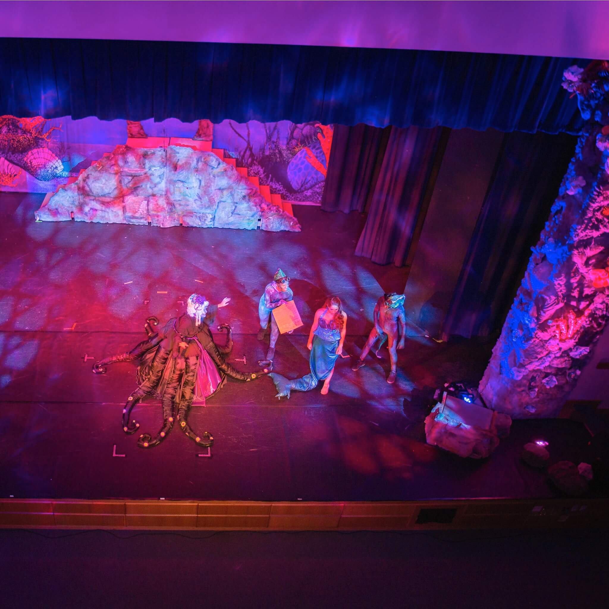 Chauvet DJ Freedom Par H9 IP X4 - RGBAW+UV LED Wireless Uplighting Kit, deployed in a theater