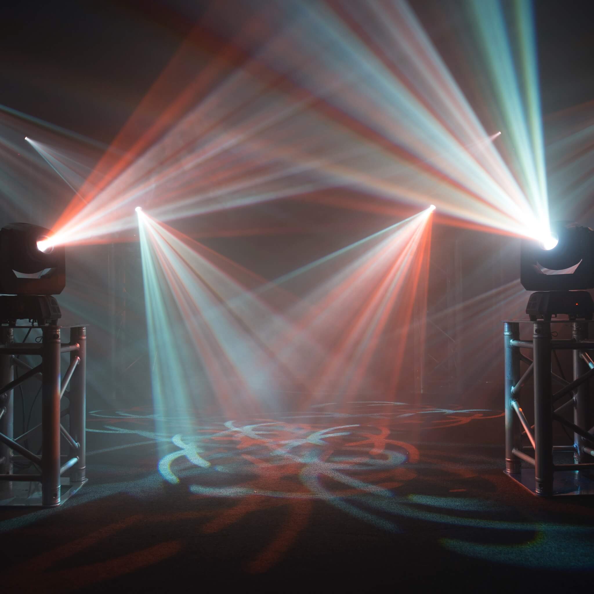 Multiple Chauvet DJ Intimidator Spot 60 ILS - 70W LED Moving Head Fixtures on stage