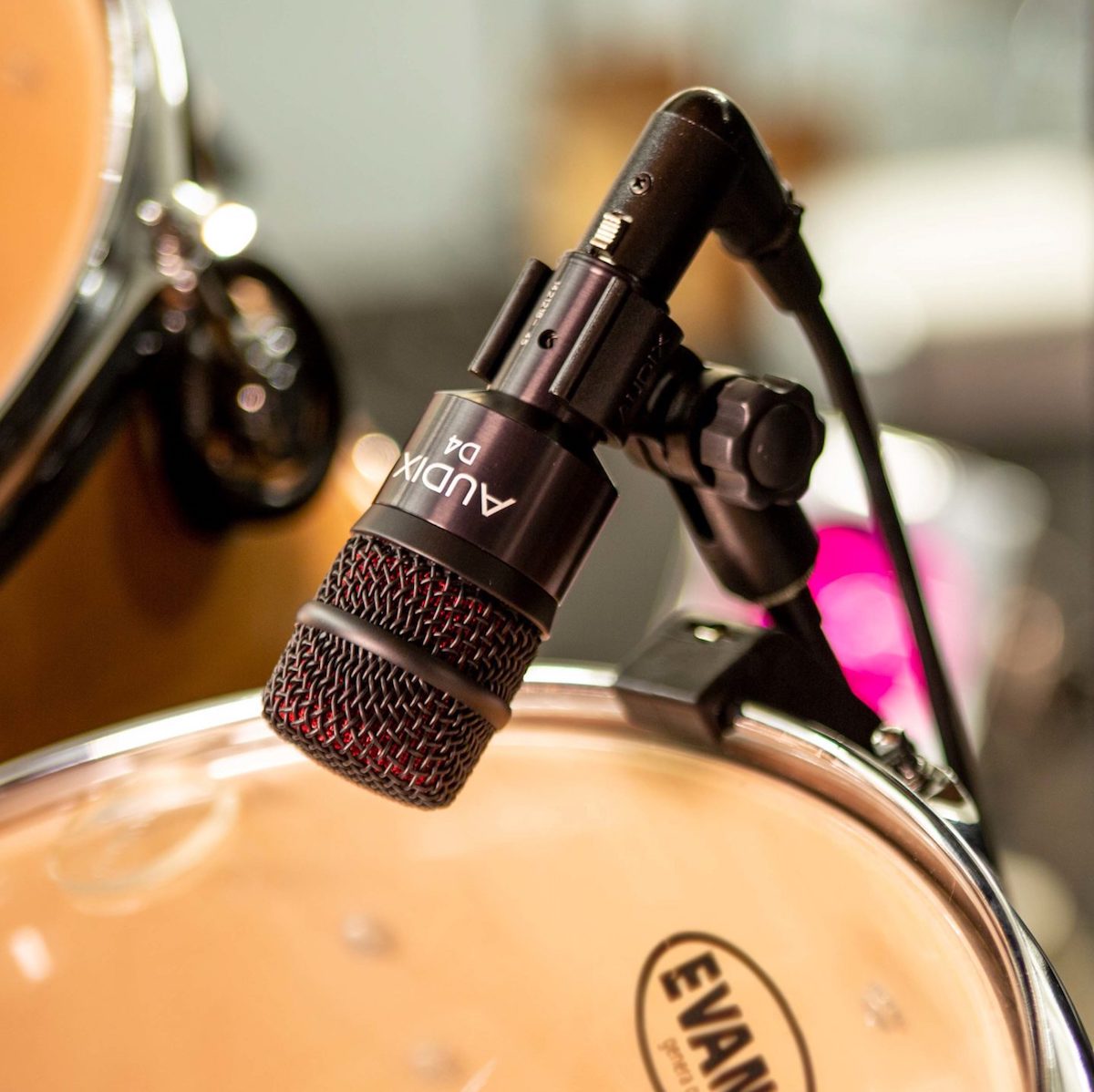 Audix D4 Professional Dynamic Instrument Microphone shown with drum set
