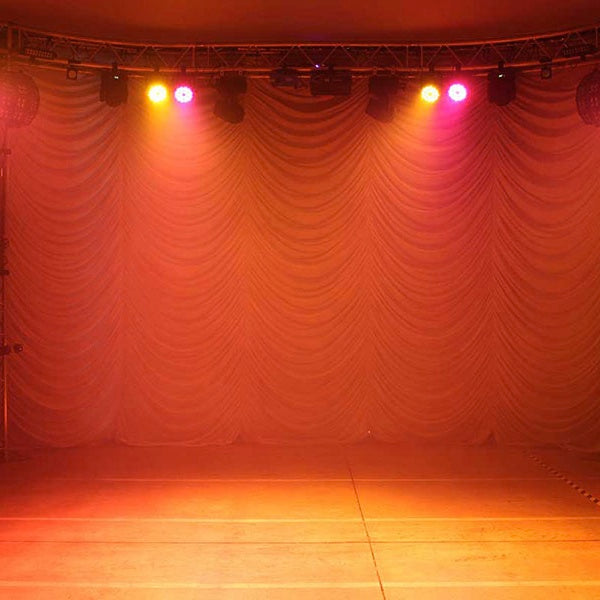 Blizzard Lighting RokBox 5 RGBAW LED Wash Light, orange lit stage