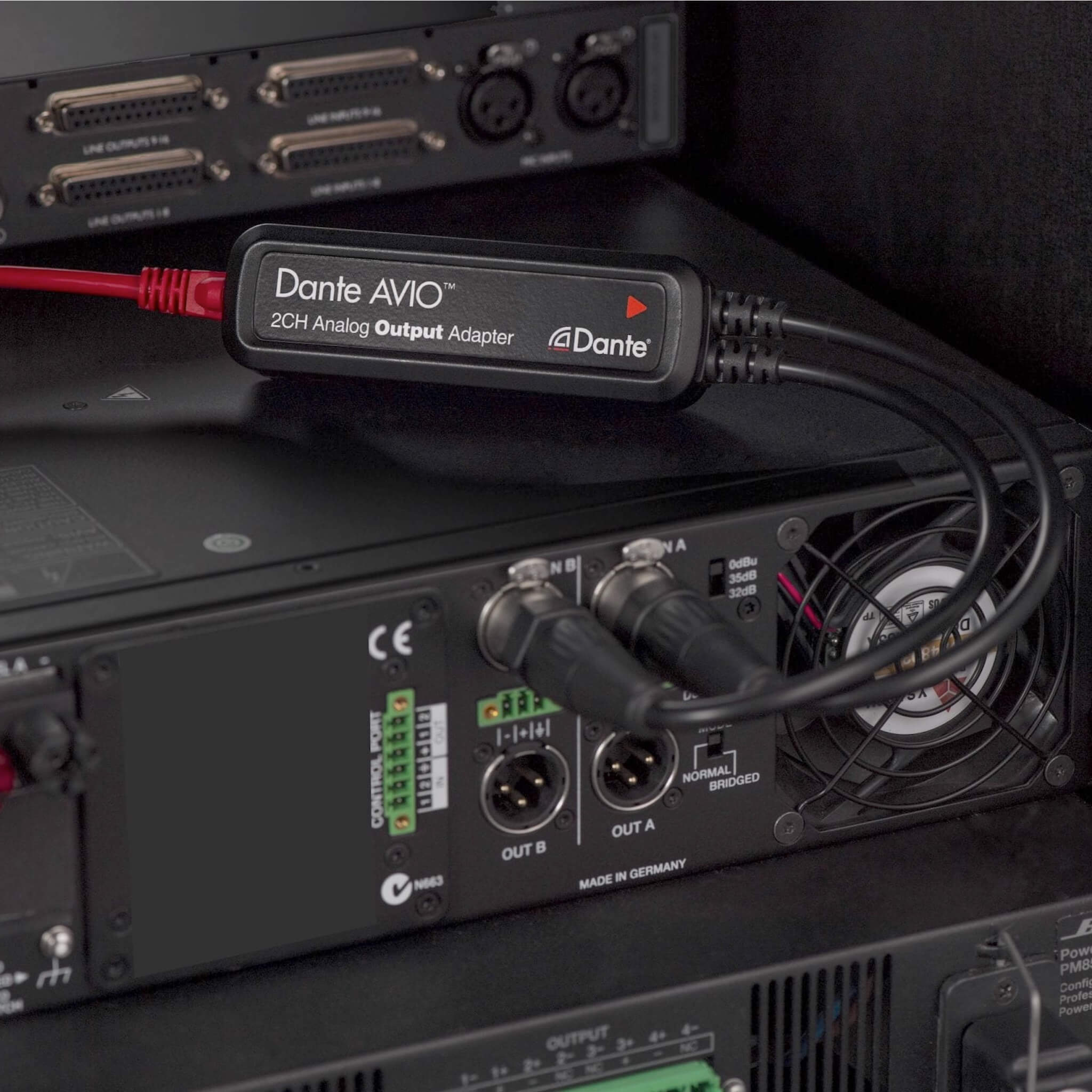 Audinate Dante AVIO 2-Channel Analog Output Adapter, connected to a power amp