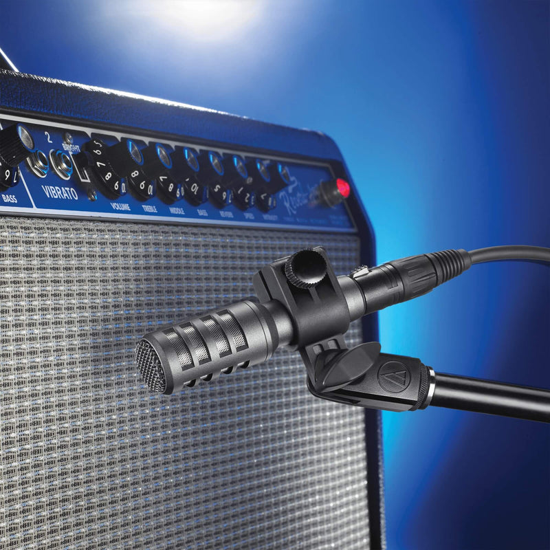 Audio-Technica AE2300 - Cardioid Dynamic Instrument Microphone, mounted in front of an amplifier