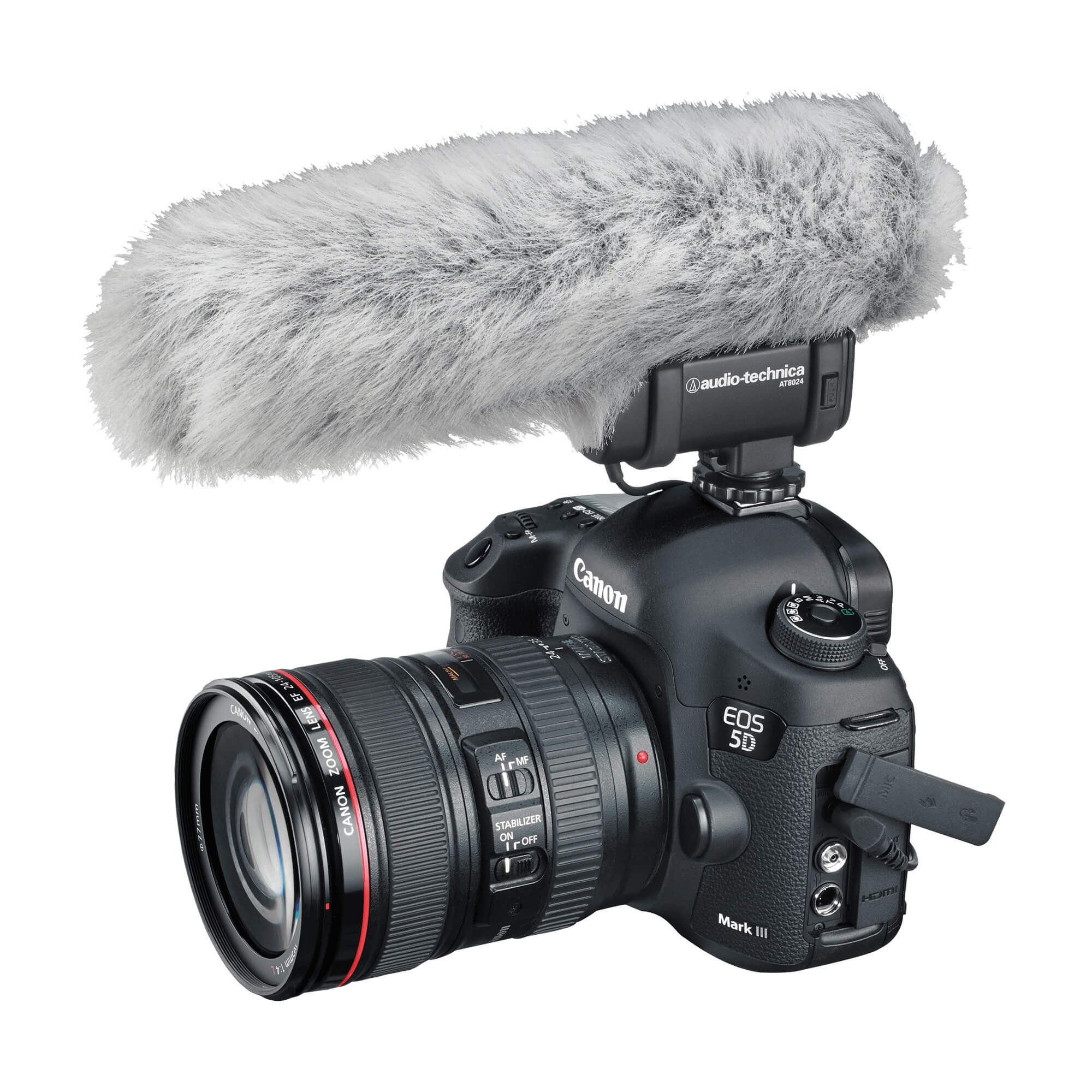 Audio-Technica AT8024 - Stereo/Mono Camera-Mount Microphone, mounted on a DSLR camera with included fuzzy windscreen