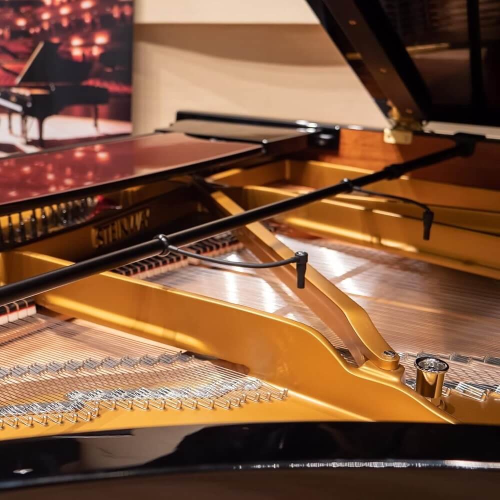 Close-up of an open grand piano showing the Earthworks PM40 Piano Microphone System