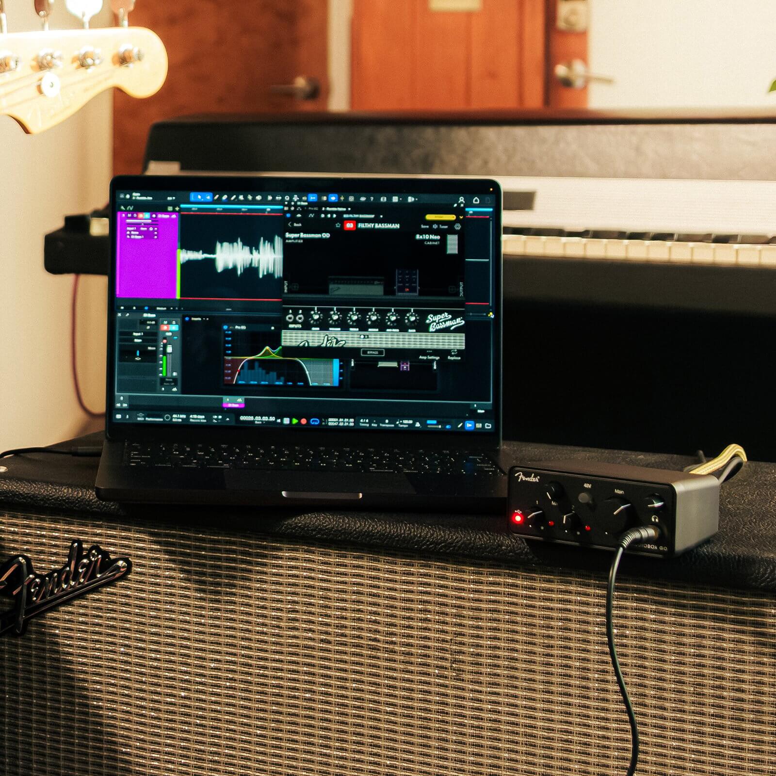 Fender AudioBox Go USB-C audio interface connected to a laptop with music production software