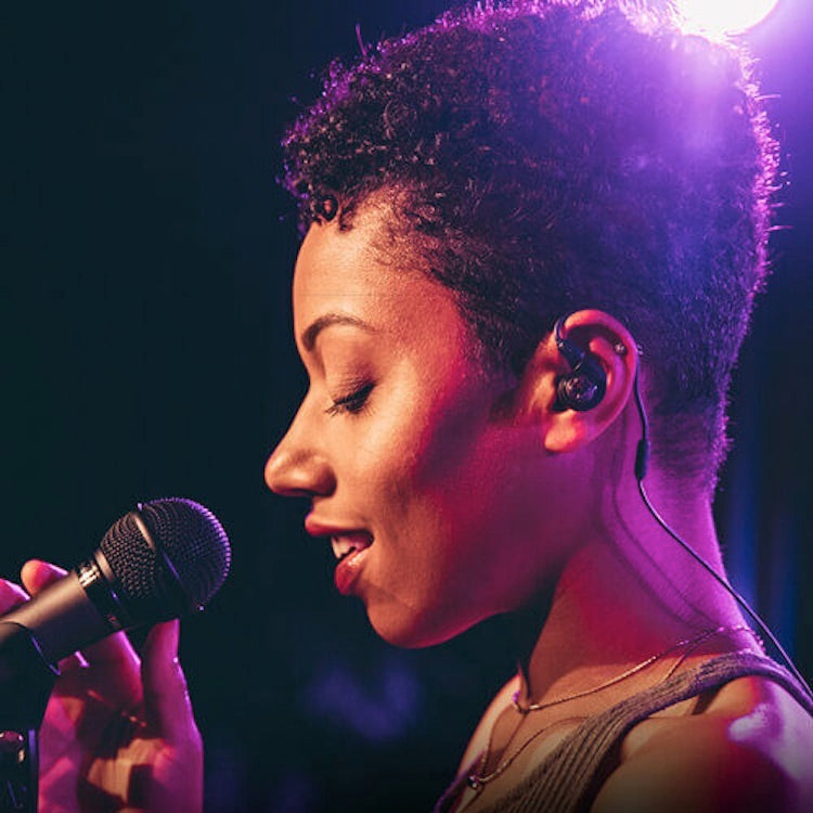 Audio-Technica ATW-3255 - 3000 Series Wireless In-Ear Monitor System, worn by a female singer