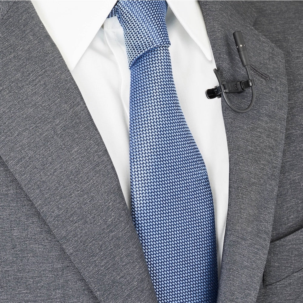 Audio-Technica BP898 - Subminiature Cardioid Condenser Lavalier Microphone shown attached to a suit coat
