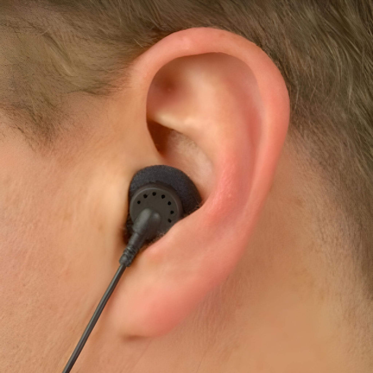 Listen LA-404 - Single Ear Bud, Friction Fit with One Replaceable Cushion, shown in ear