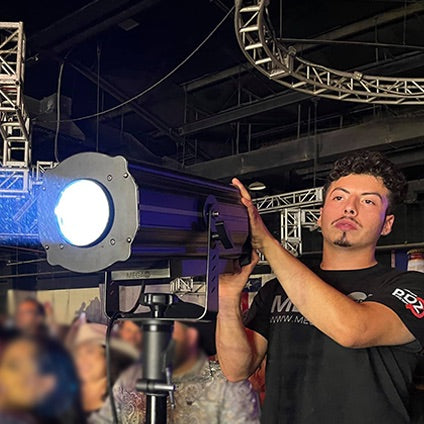 Mega-Lite Drama FS-LED 700 - Follow Spot LED Fixture shown with stage hand operator