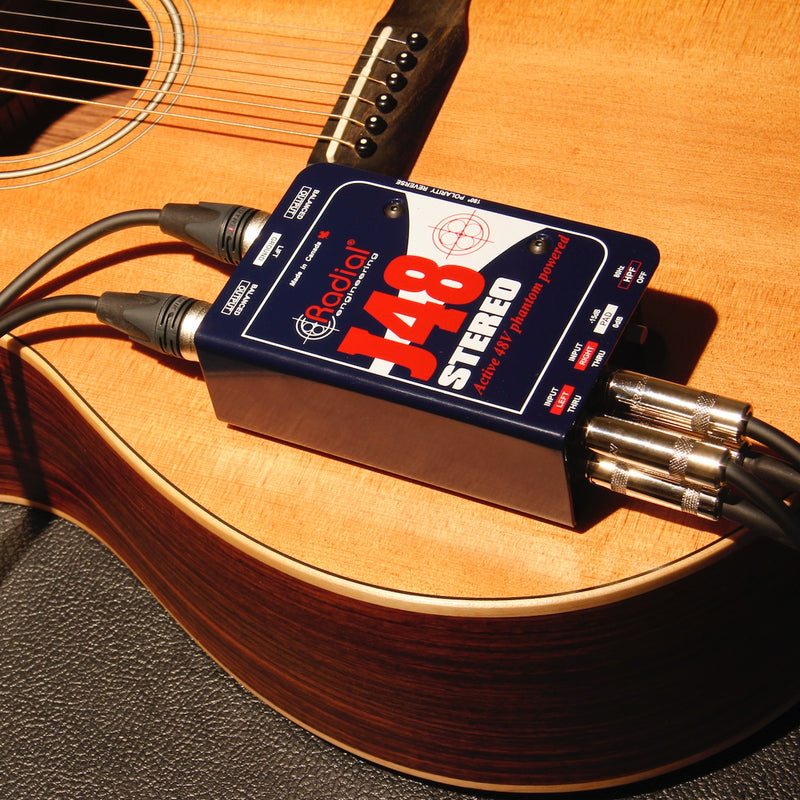Radial J48 Stereo - Phantom Powered Active Direct Box, shown in use on an acoustic guitar
