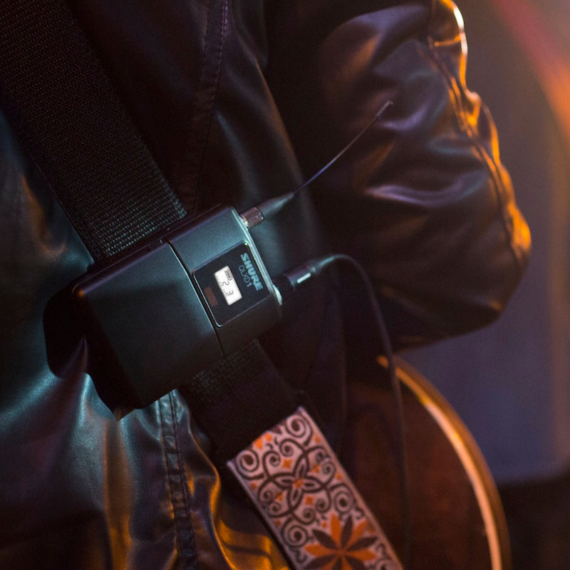 Shure QLXD1 - Wireless Bodypack Transmitter for QLX-D Systems, worn on a guitar strap